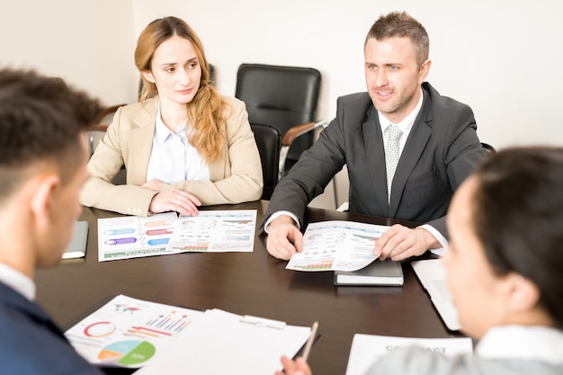 Mature Businessman Speaking in Meeting