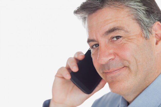 Mature businessman using cell phone