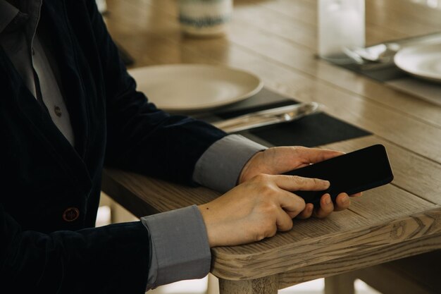 Mature businessman using a digital tablet to discuss information with a younger colleague in a moder