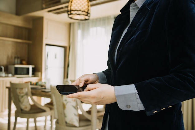 Mature businessman using a digital tablet to discuss information with a younger colleague