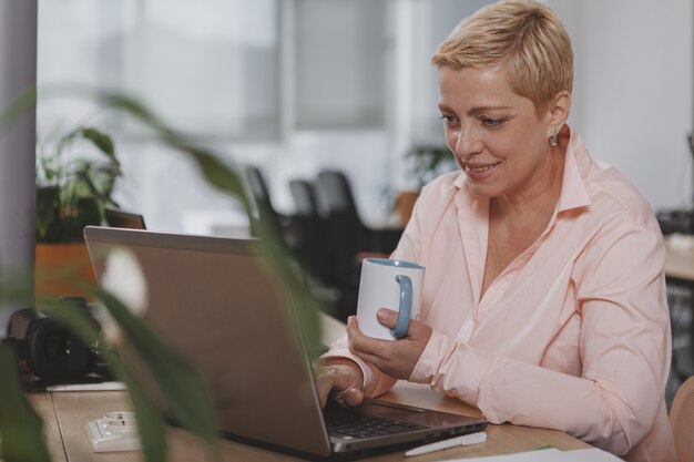 Mature businesswoman working at the office