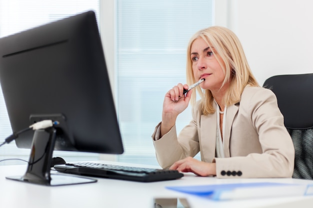 Mature businesswoman working with the laptop