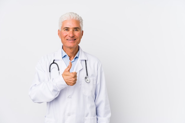 Mature caucasian doctor man smiling and raising thumb up