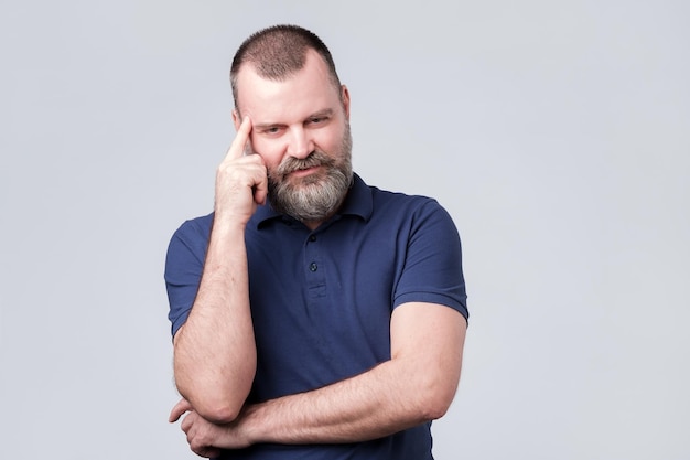 mature caucasian man thinking about his life problem