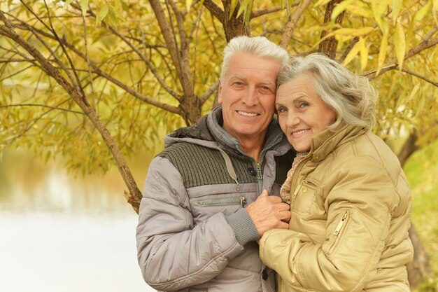 Mature couple in the autumn park