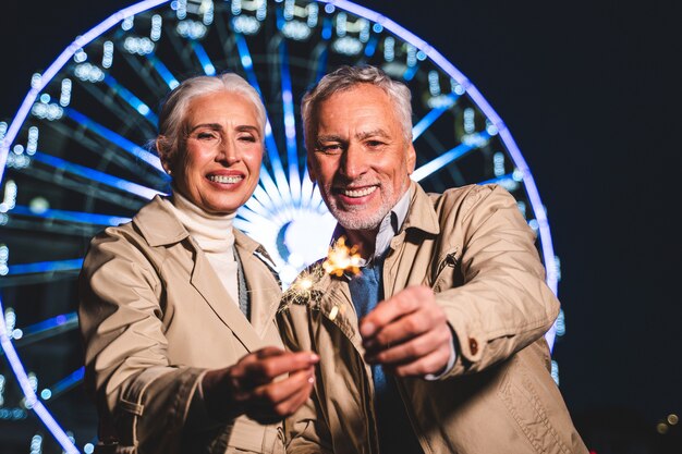 Mature couple having fun at amusement park