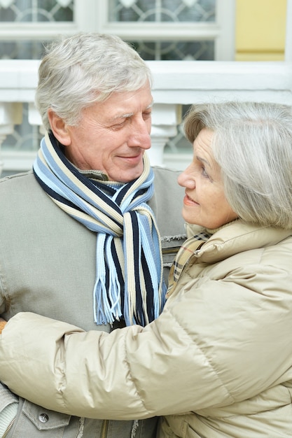 Mature couple having fun in the autumn park