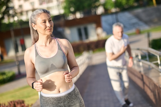 A mature couple having their morning jogging in the park