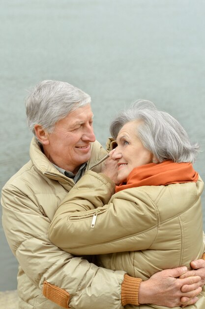 Mature couple near wall on a street