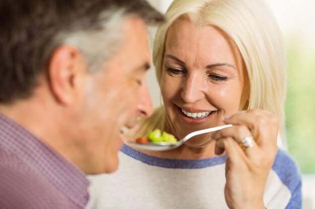 Mature couple preparing meal together