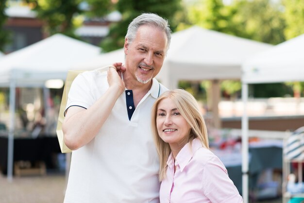 Mature couple shopping in a street market