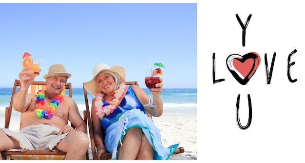 Mature couple sitting on deck chairs against cute valentines message