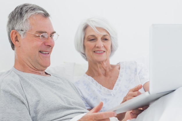 Mature couple using a laptop together