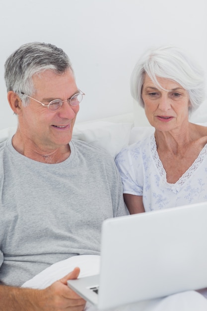 Mature couple using a laptop