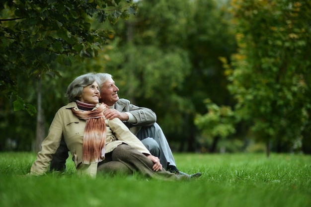 Mature couple walking in the autumn park