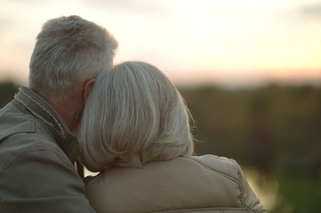 Mature couple walking in the autumn park