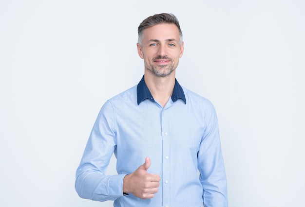 Mature entrepreneur smile in businesslike wear on grey background