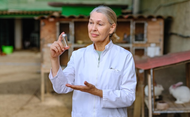 Mature female veterinarian on a farm