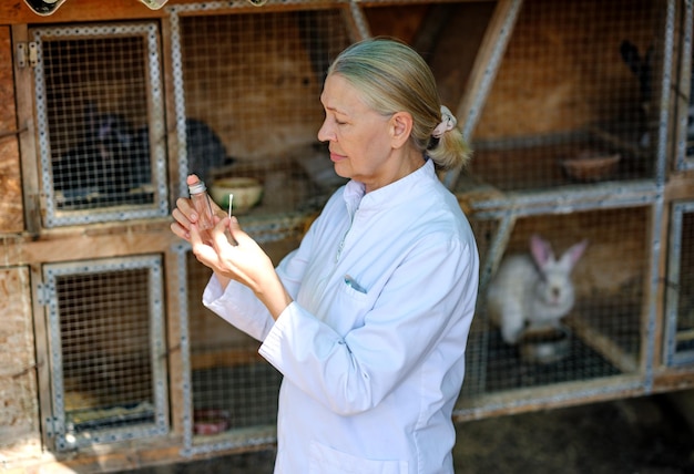 Mature female veterinarian on a farm