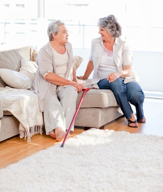 Mature friends talking on the sofa