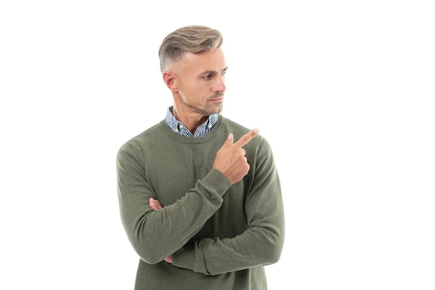 Mature grizzled guy with stubble pointing finger isolated on white background grizzled guy in sweater grizzled guy has stubble studio shot of grizzled guy