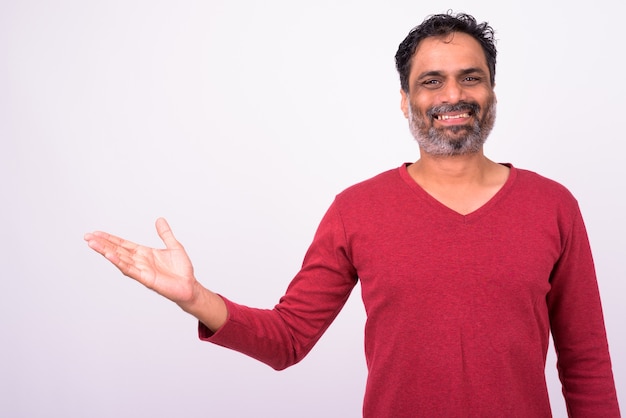 mature handsome bearded Indian man on white