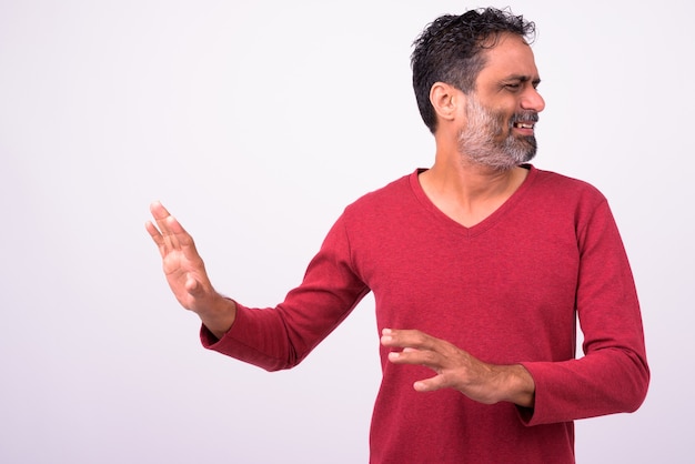 mature handsome bearded Indian man on white