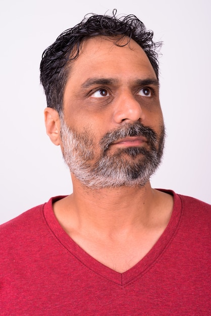 mature handsome bearded Indian man on white