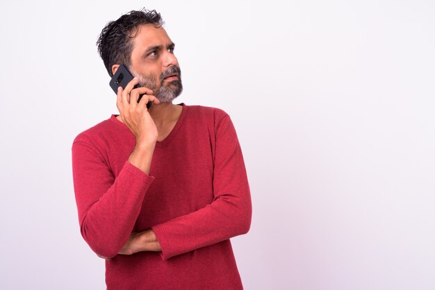 mature handsome bearded Indian man on white