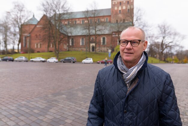 Mature handsome man enjoying life around the city of Turku, Finland