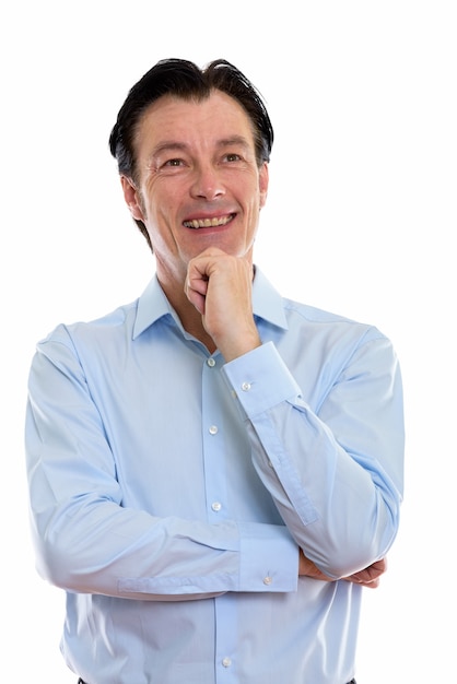 mature happy businessman smiling and thinking