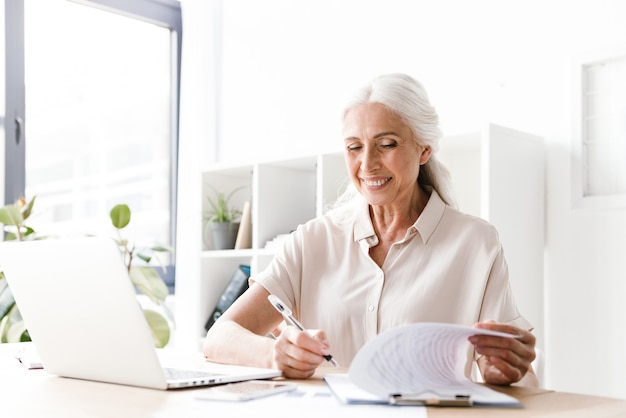 Mature happy cheerful woman indoors