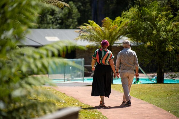 mature hipster couple hiking in the bush in australia