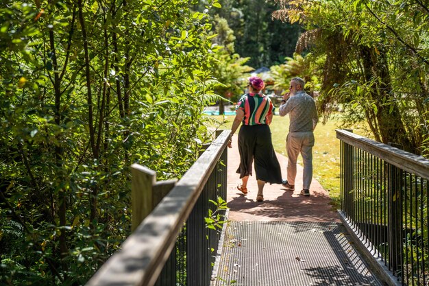 mature hipster couple hiking in the bush in australia