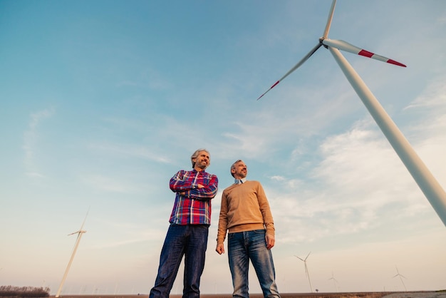 Mature maintenance engineer team working in wind turbine field