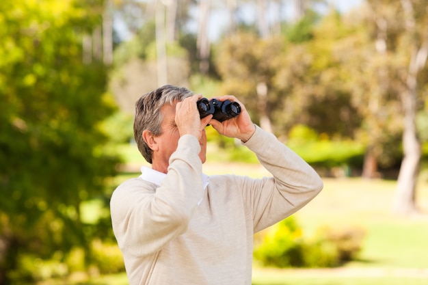 Mature man birds watching