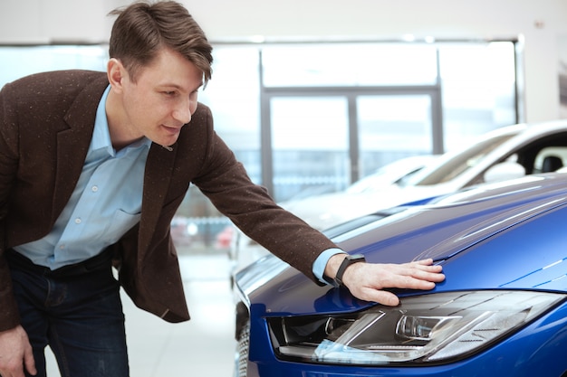 Mature man buying new car