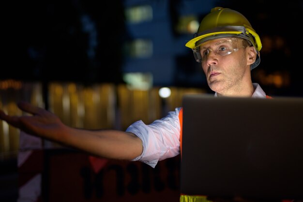 Mature man construction worker at the construction site