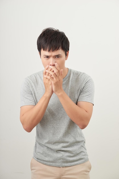 Mature man coughing on white background