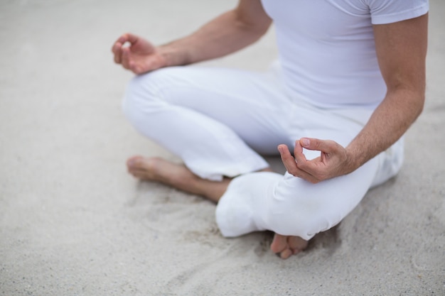 Mature man doing meditation