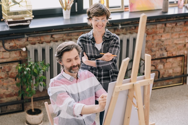 Mature Man Enjoying Art Class