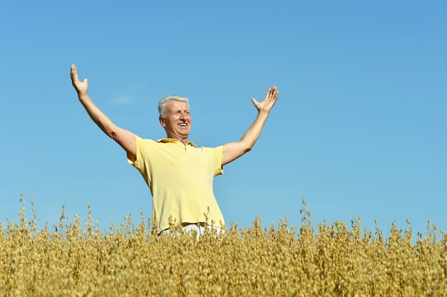 Mature man enjoying fresh air on nature