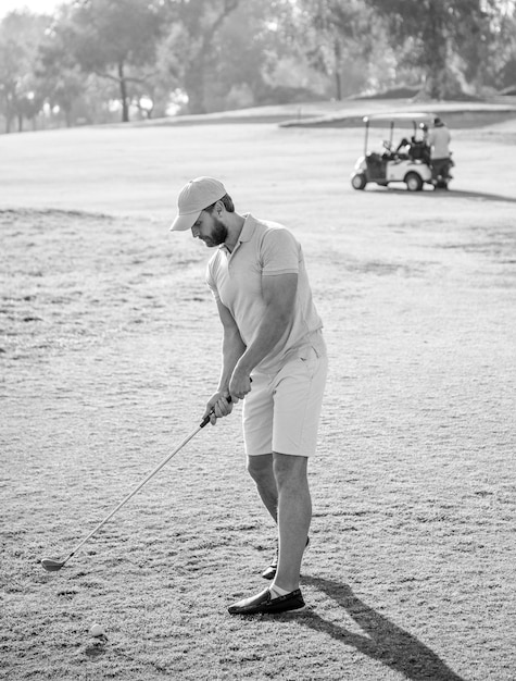 Mature man playing golf game on green grass golf swing