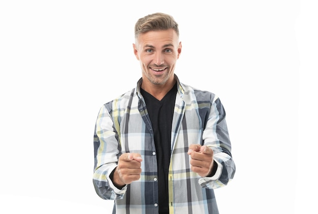 Mature man pointing in studio mature man wearing checkered shirt photo of mature man