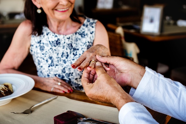 Mature man proposing to a woman