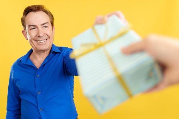 Mature man receiving a fathers day gift