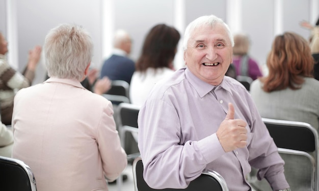 Mature man sitting in adult education class