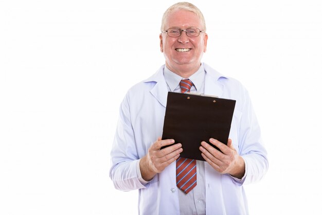 Mature man smiling and reading