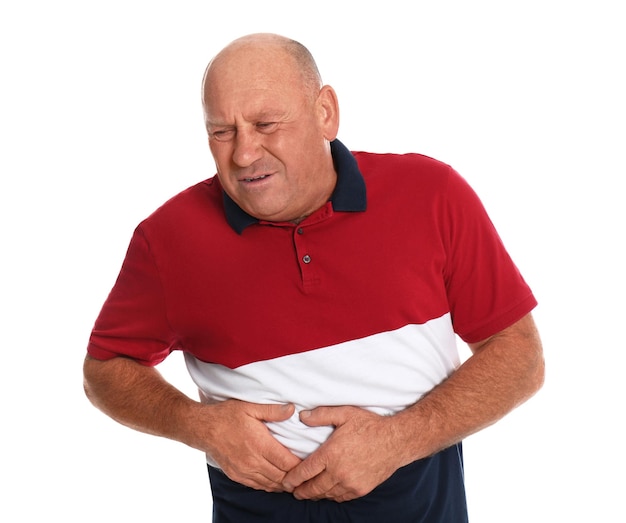 Mature man suffering from liver pain on white background