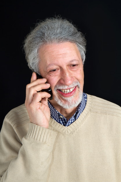 mature man talking on his mobile phone 